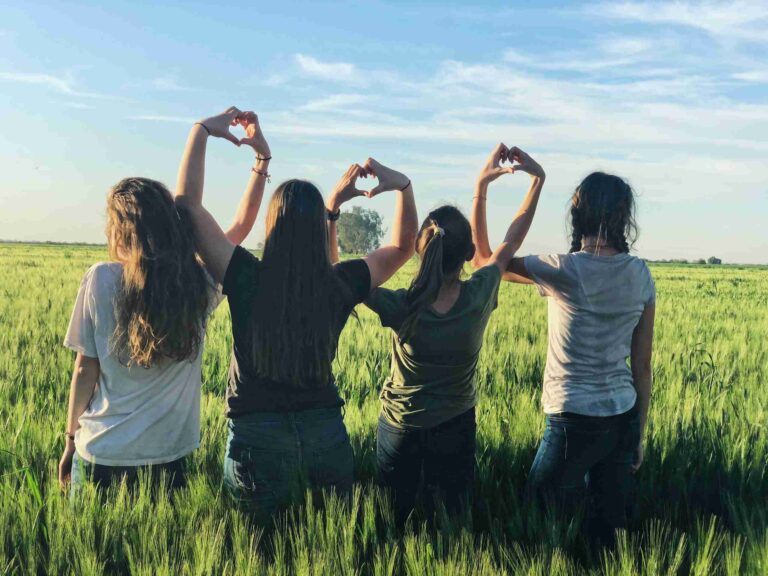 group of teen girls in a field during therapy