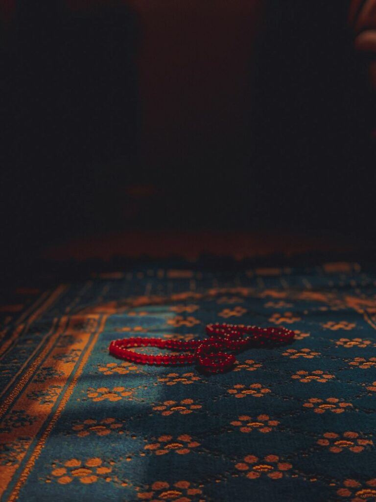 a red necklace on a rug for teen mental health awareness