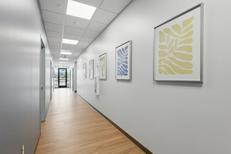 basepoint-academy-frisco-teen-mental-health-facility-hallway-with-paintings