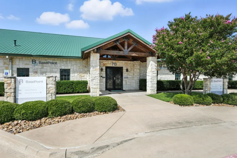 basepoint-academy-forney-teen-mental-health-facility-entryway-with-bushes