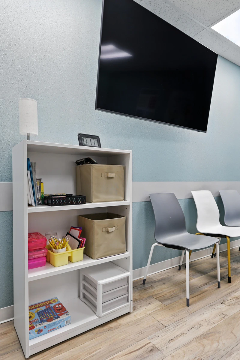 basepoint-academy-forney-teen-mental-health-facility-shelf-with-tv