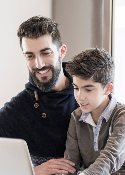 A father and son talk to a mental health therapist online