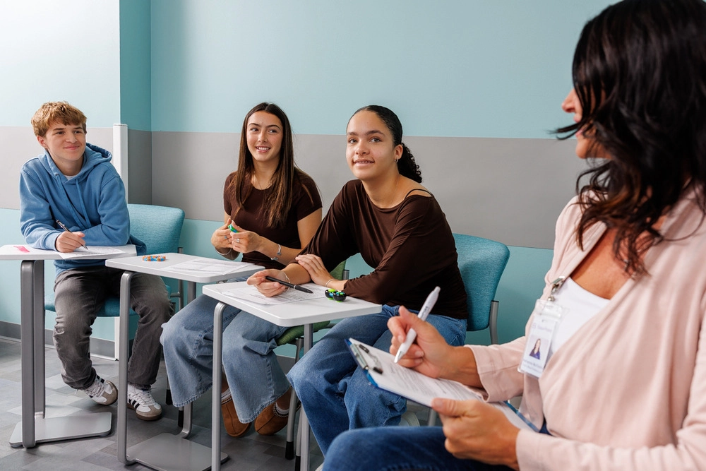 Teens doing work while in BasePoint Academy's Summer enrichment program