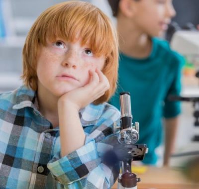 An adolescent boy has trouble concentrating in class