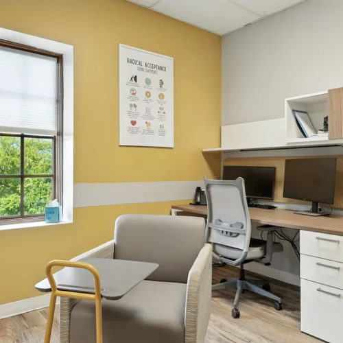 basepoint-academy-forney-teen-mental-health-facility-small-group-room-yellow-with-desk-and-window