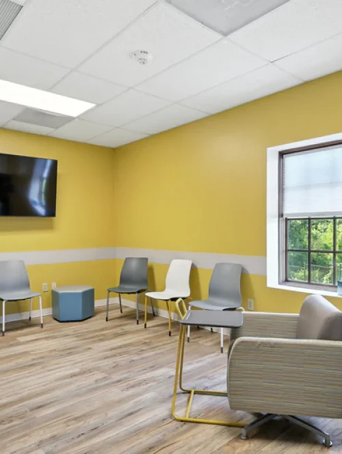 basepoint-academy-forney-teen-mental-health-facility-small-group-room-yellow-with-tv basepoint-academy-forney-teen-mental-health-facility-small-group-room-yellow-with-tv