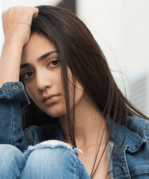 young teen girl struggling with addiction