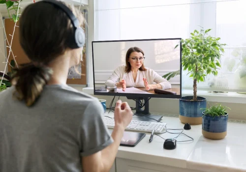 Teen girl in online mental health therapy session