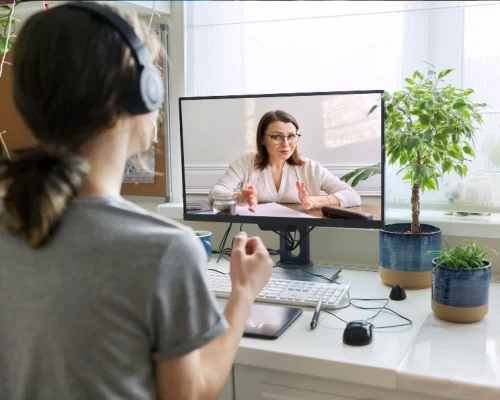 Teen girl in online mental health therapy session