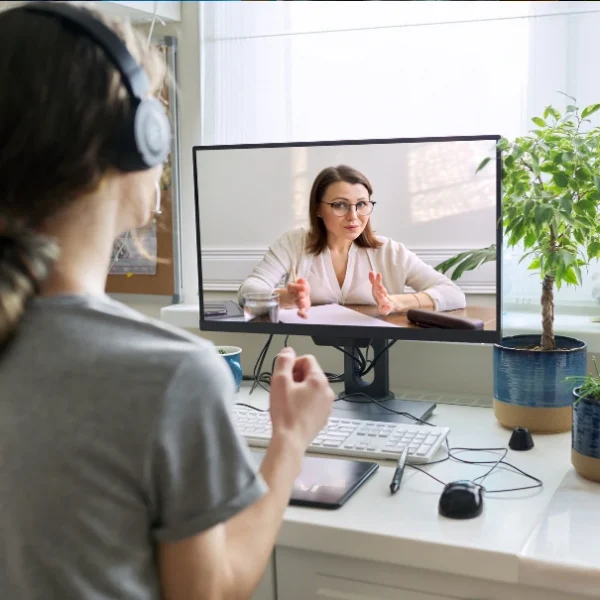 Teen girl in online mental health therapy session
