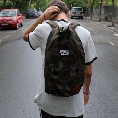 Young boy walking in the middle the road dealing with mental health issues as a teenagers