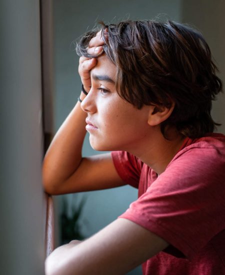 Young boy showing sign of depression